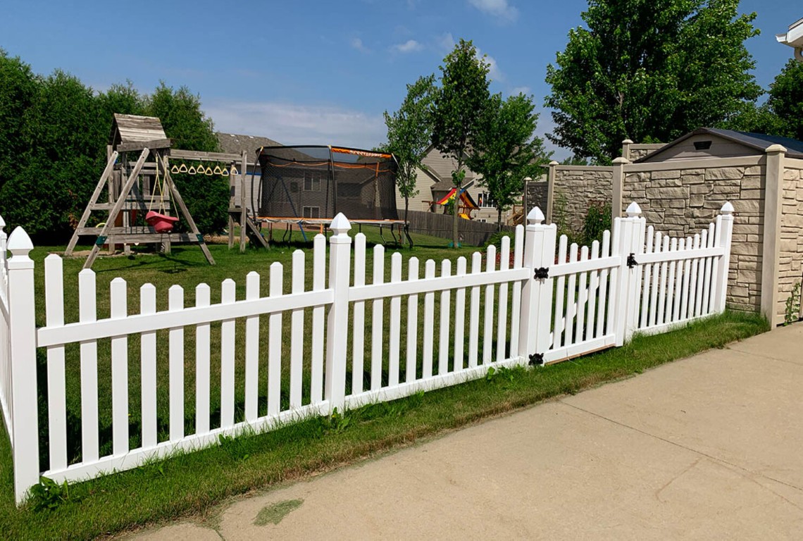 White picket fence providing security for Quincy, IL home